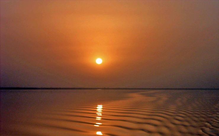 Vietnam, China - Sunset on the River Gambia.jpg